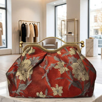 Clutch "Cheriè" con trama in rilievo e maniglia in ottone | Anembags