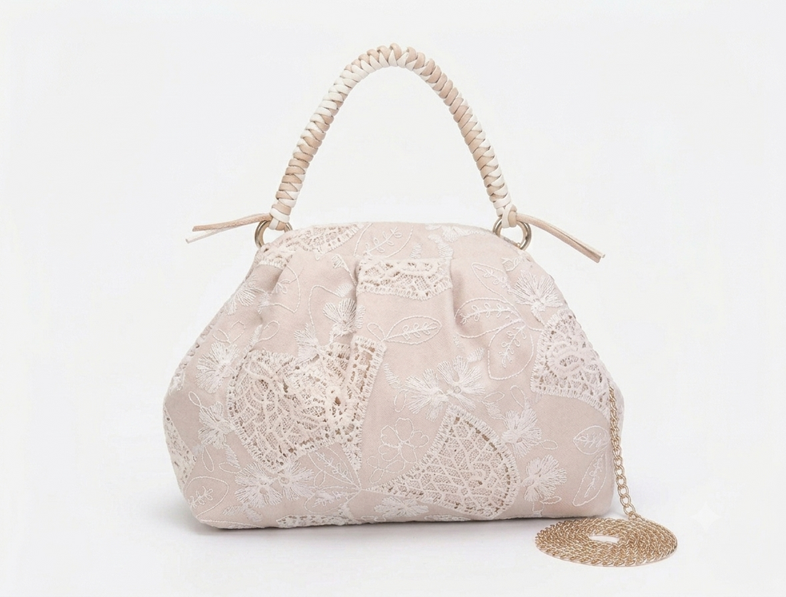 Borsa a mano Rasha in tessuto ricamato Anembags