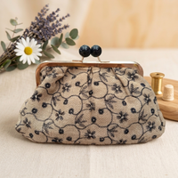 Borsa Clelia clucht con pomelli laccati Anembags