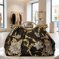 Clutch "Cheriè" con trama in rilievo e maniglia in ottone | Anembags