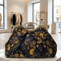 Clutch "Cheriè" con trama in rilievo e maniglia in ottone | Anembags