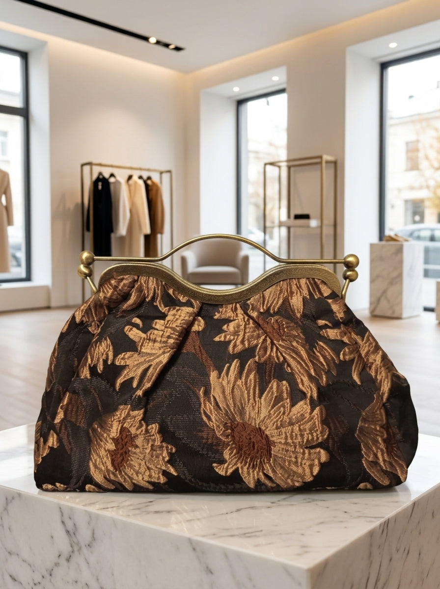 Clutch "Cheriè" con trama in rilievo e maniglia in ottone | Anembags