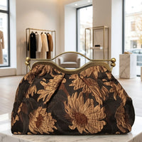 Clutch "Cheriè" con trama in rilievo e maniglia in ottone | Anembags